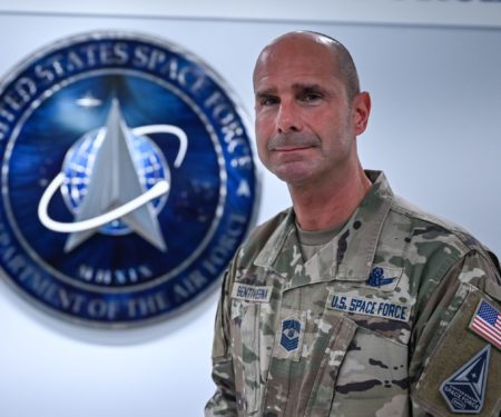 Chief Master Sgt. John F. Bentivegna stands in front of the U.S. Space Force Hallway after receiving news on his selection as the next Chief Master Sergeant of the Space Force, Pentagon, Arlington, Va., May 5, 2023.