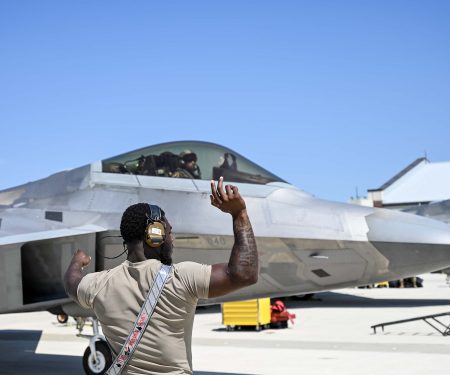 A maintainer from the 71st Fighter Generation Squadron taxis pre-flight a student conducting their first F-22 flights during training at Joint Base Langley-Eustis, Virginia, June 5, 2023. U.S. Air Force photo by Tech. Sgt. Ceaira Tinsley