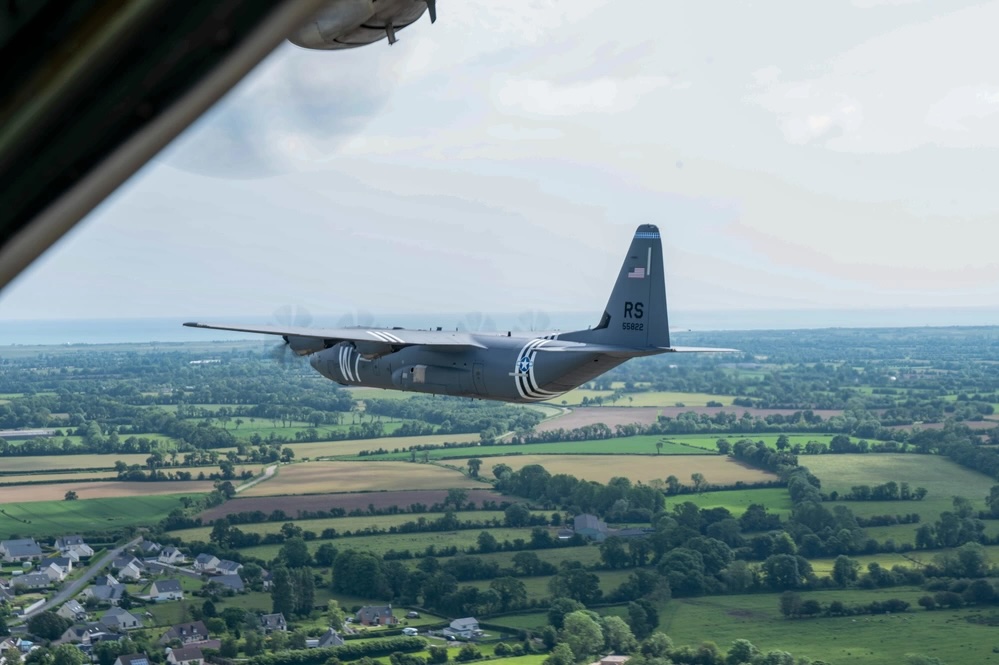 PHOTOS: Invasion-Striped C-130s Soar Over France for 80th Anniversary of D-Day